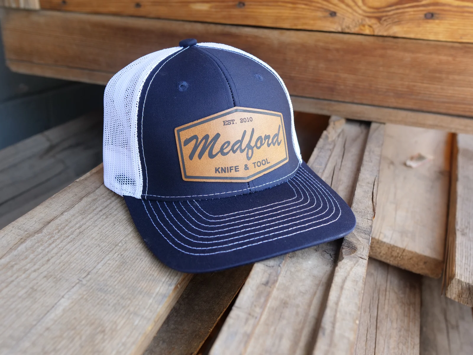 Medford Knife & Tool Leather Patch Snapback Hat – Navy Blue — Front