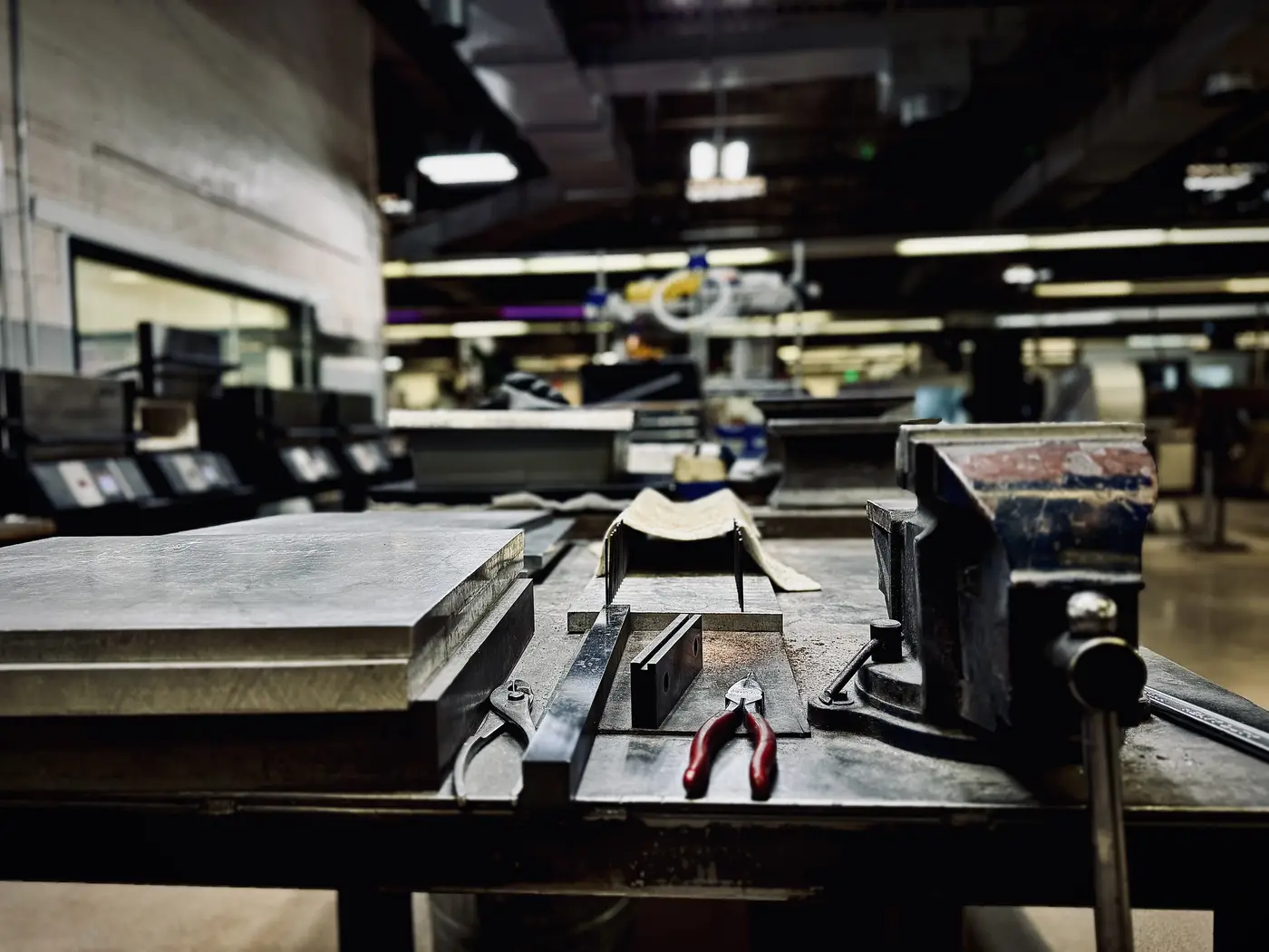 Craftsman point-of-view of the blade straightening station at Medford Knife, Phoenix