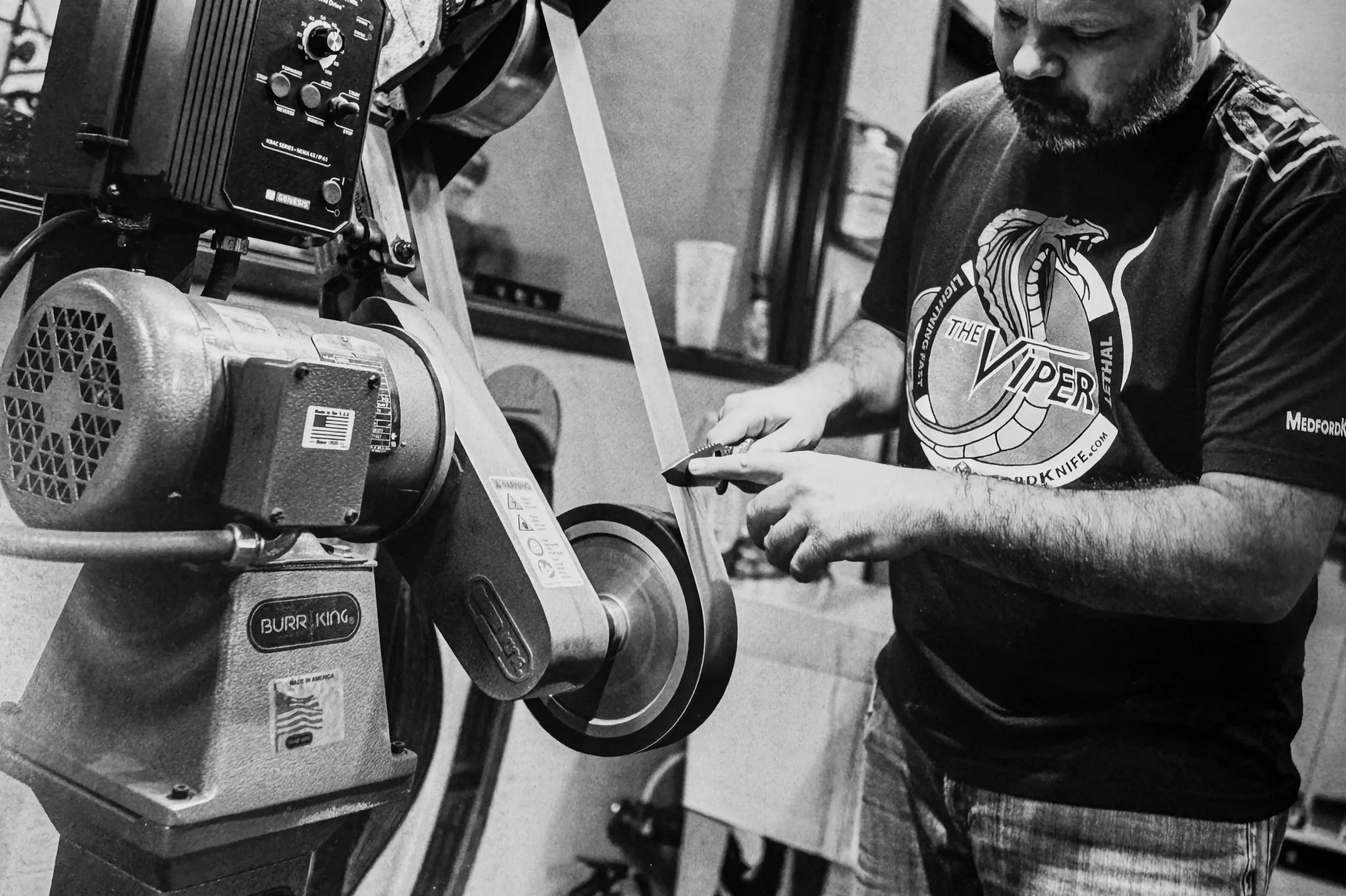 Greg Medford hand-sharpening a knife blade on a Burr King grinder at Medford Knife and Tool, Phoenix AZ