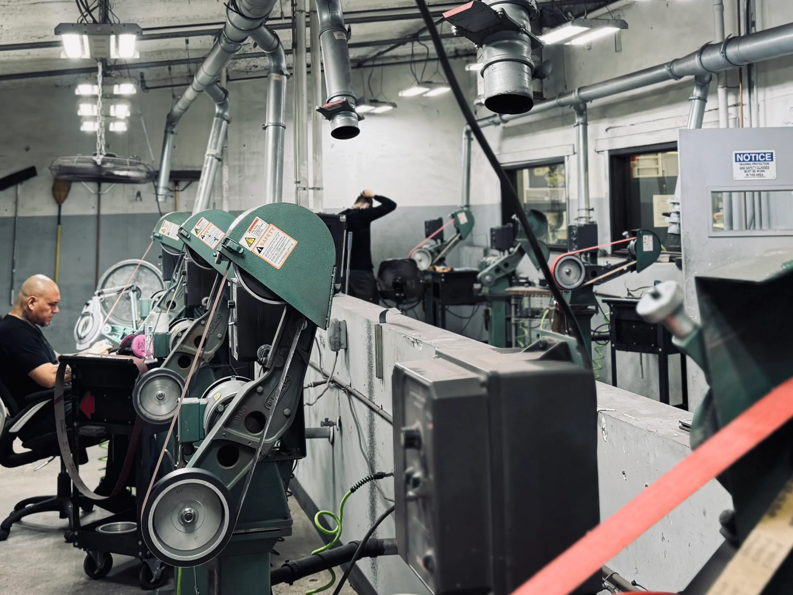 Belt grinders in the Medford Knife and Tool grind room, Phoenix AZ