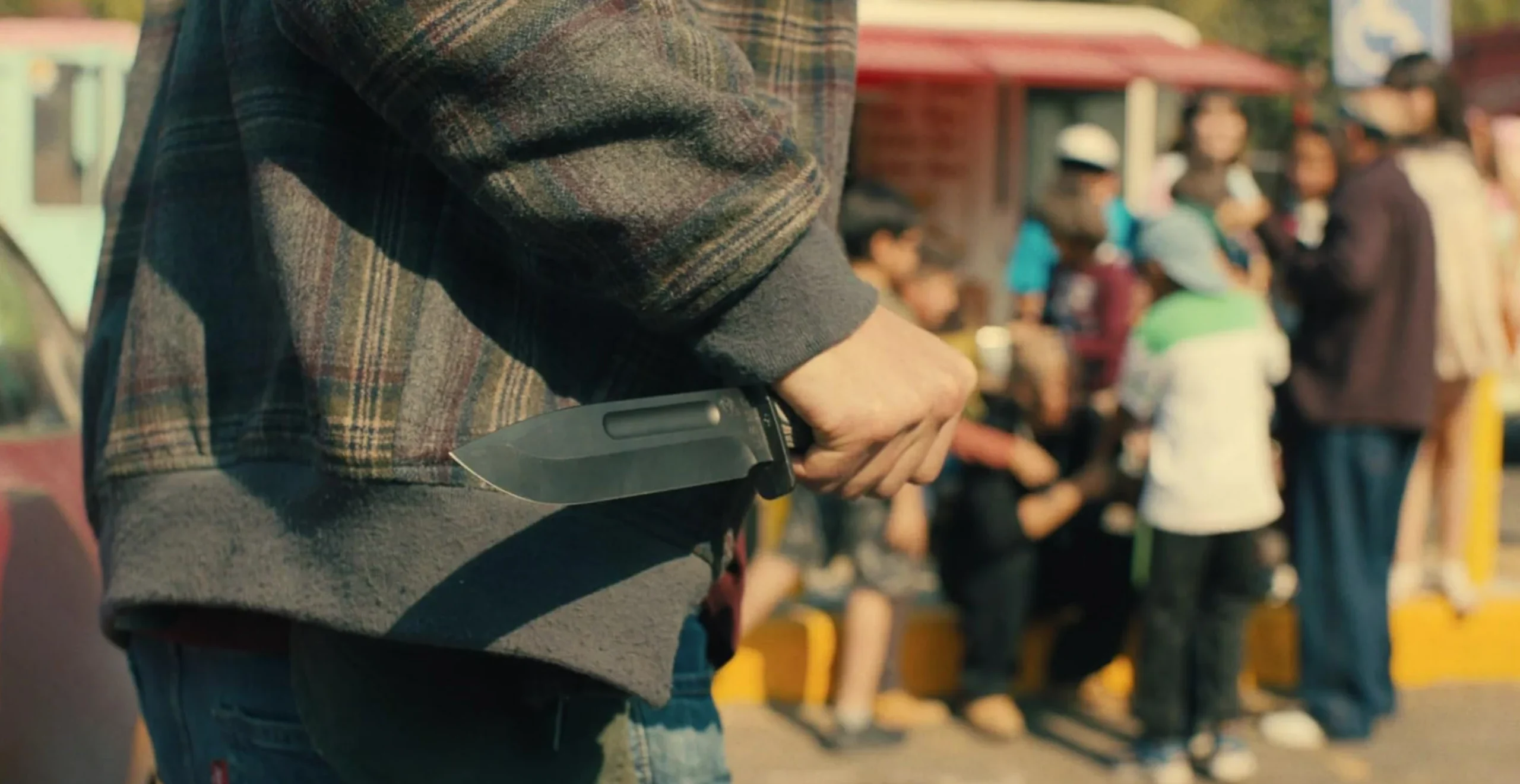 Character carrying the Medford USMC Fighter fixed blade in Silent Night (2023)