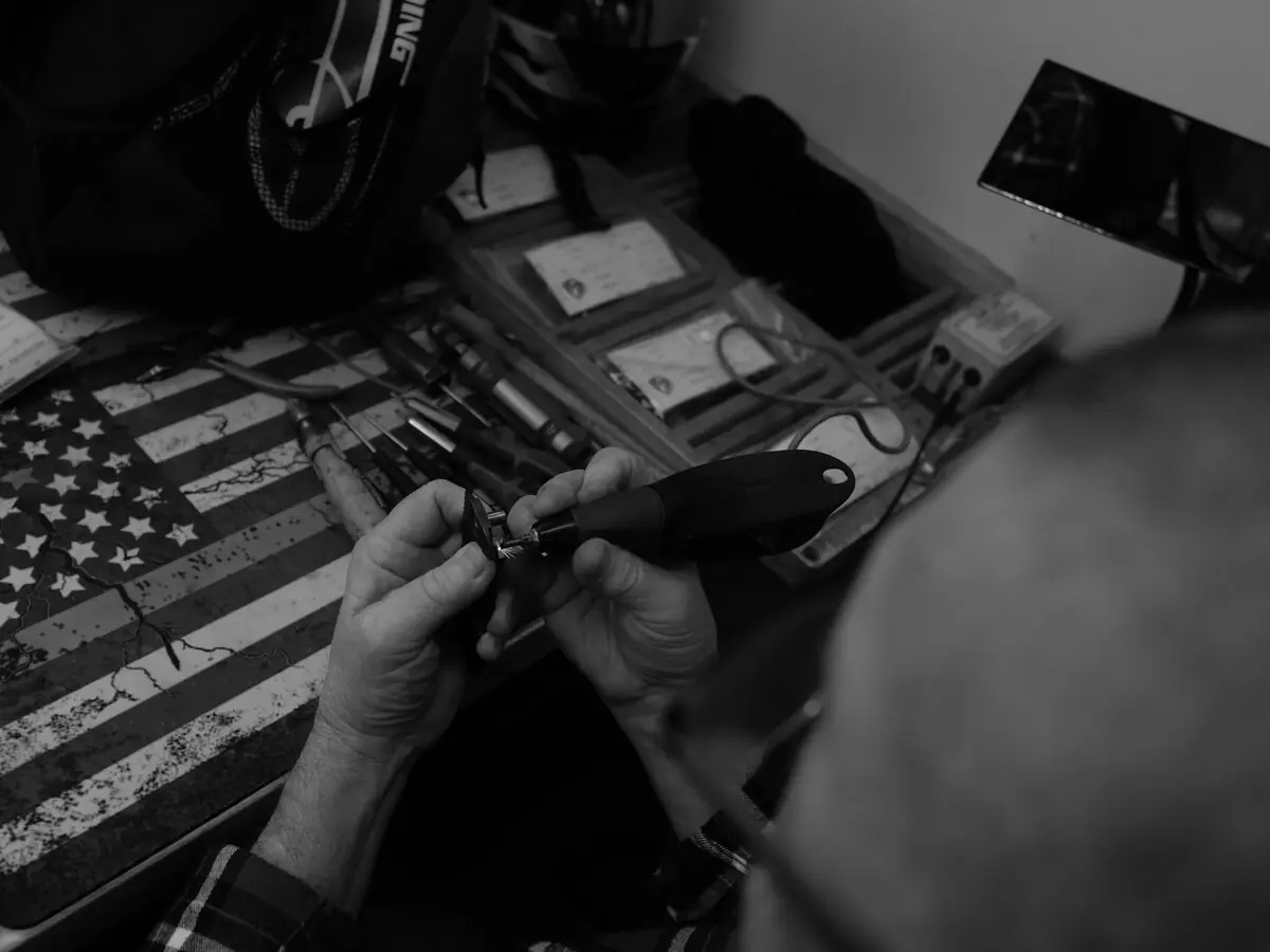 MKT craftsperson assembling a knife