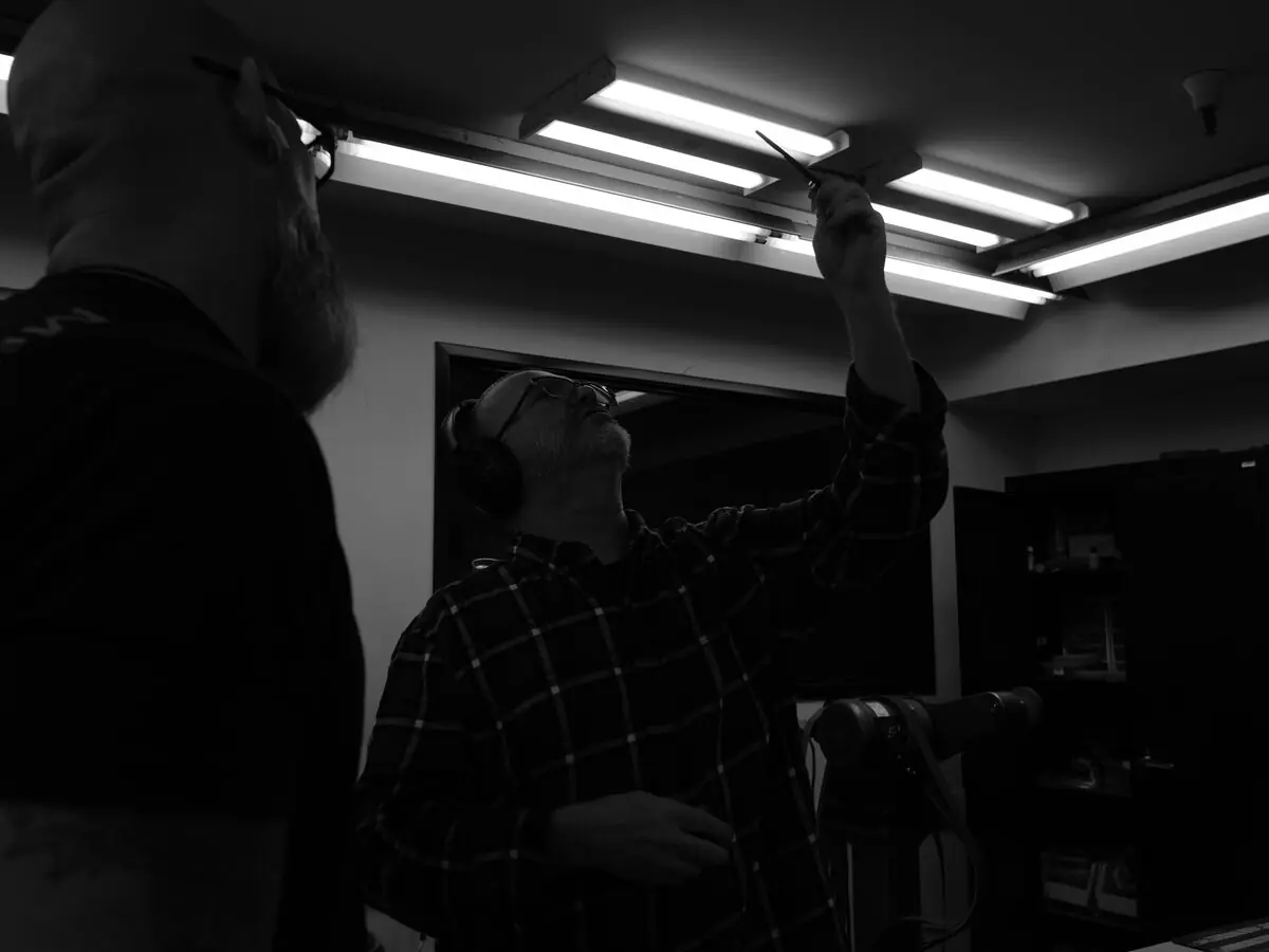 MKT craftsperson inspecting a knife