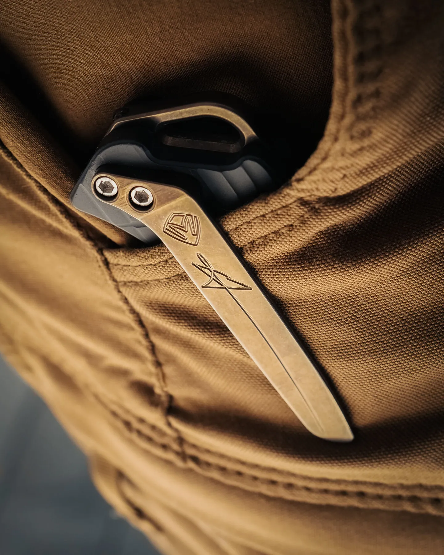Torrent pocket clip against tan fabric